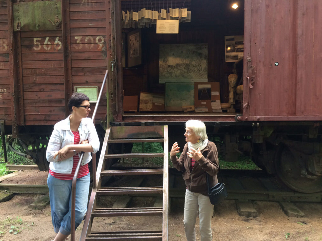 2 ladies in front of al old train car
