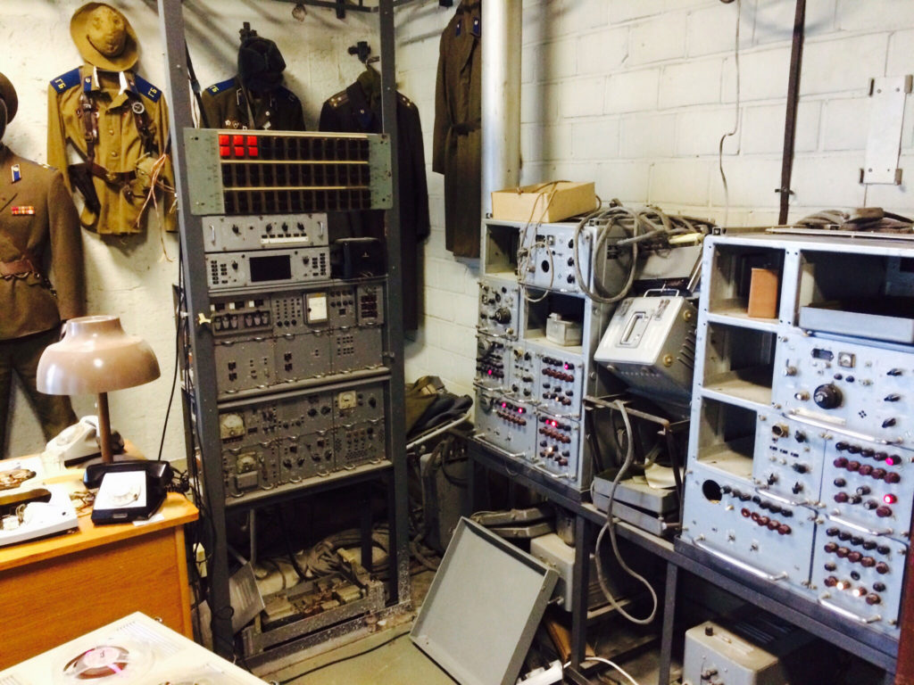 an old office full of radios and listening devices