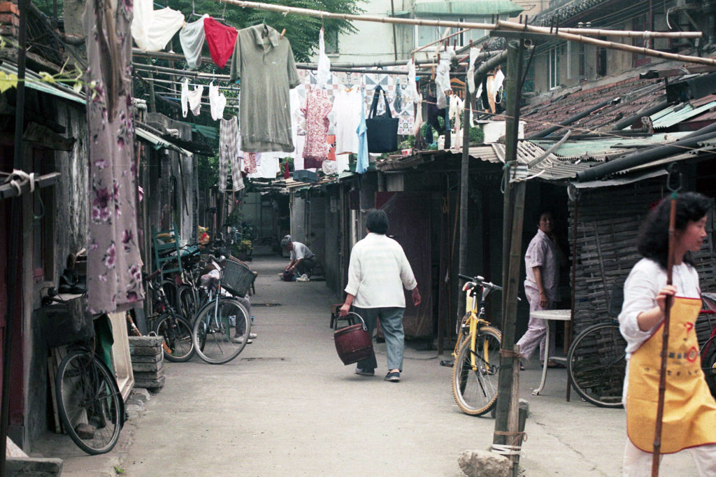 a narrow alley between shanties