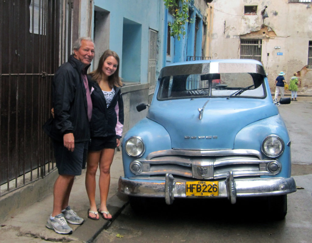 Briana & Chip Averwater in front of an old car in Havana, Cuba