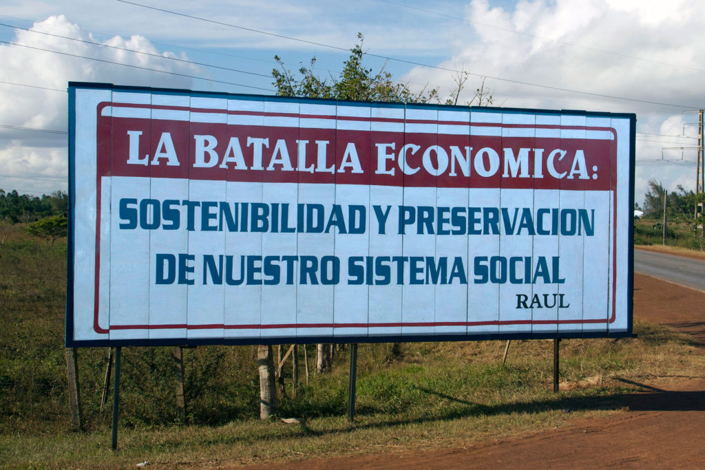 A large sign on the side of the highway in Cuba