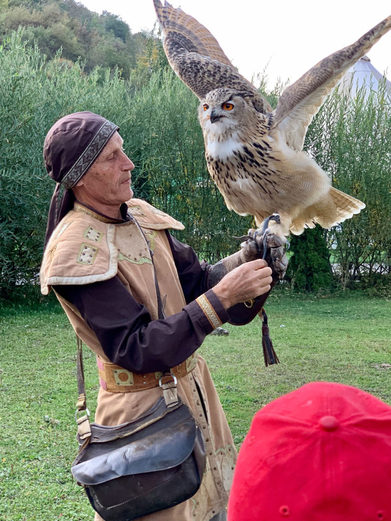 a Kazakh bird trainer with a large bird