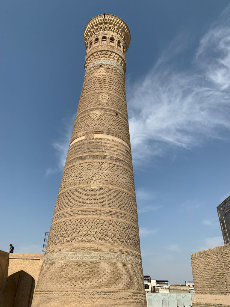 looking up at a tall minaret