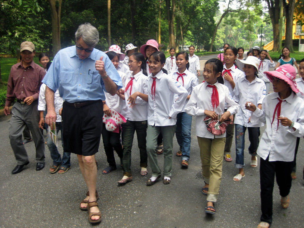 a group of Vietnamese school girls following Steve