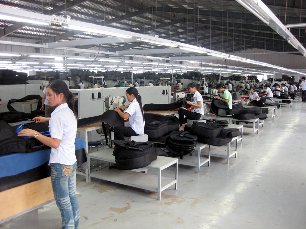 a neat line of Vietnamese at sewing machines