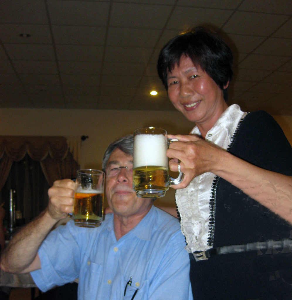 A Vietnamese lady with a beer beside Steve