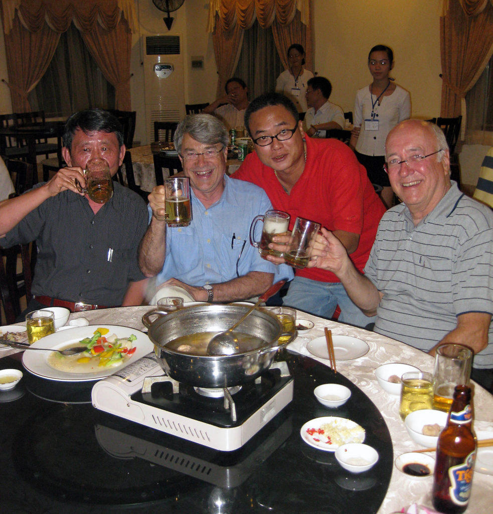 2 Vietnamese and 2 Americans drinking beer